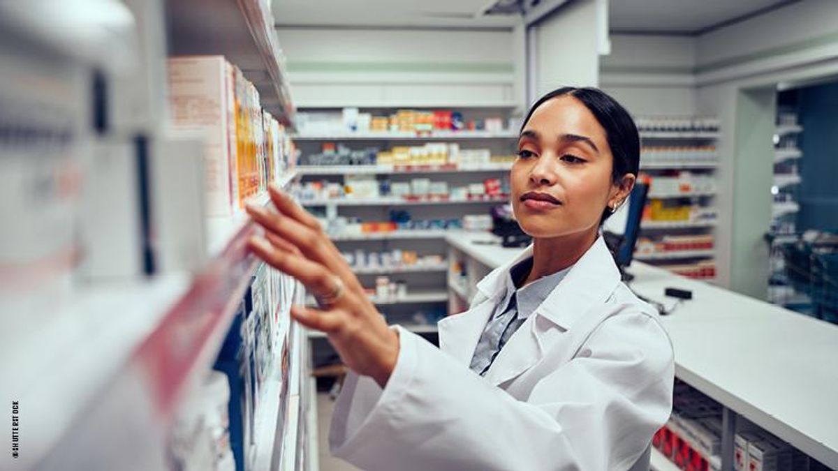 A woman pharmacist looks through medications
