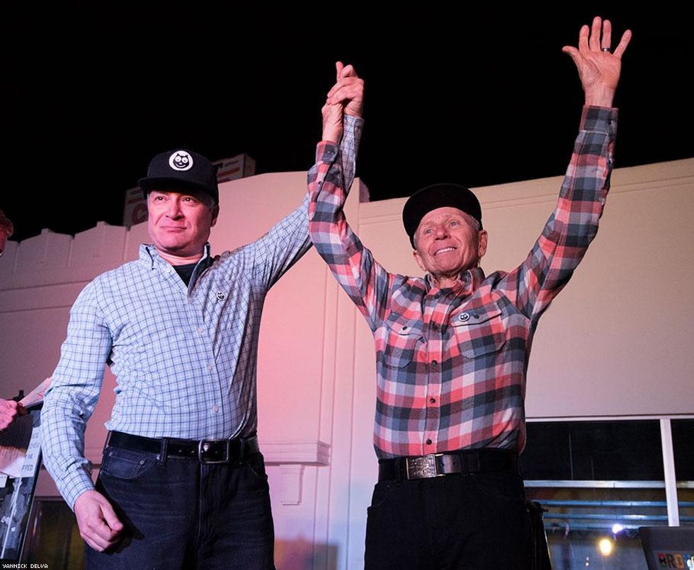 Alexei Romanoff and his husband are cheered by the crowd