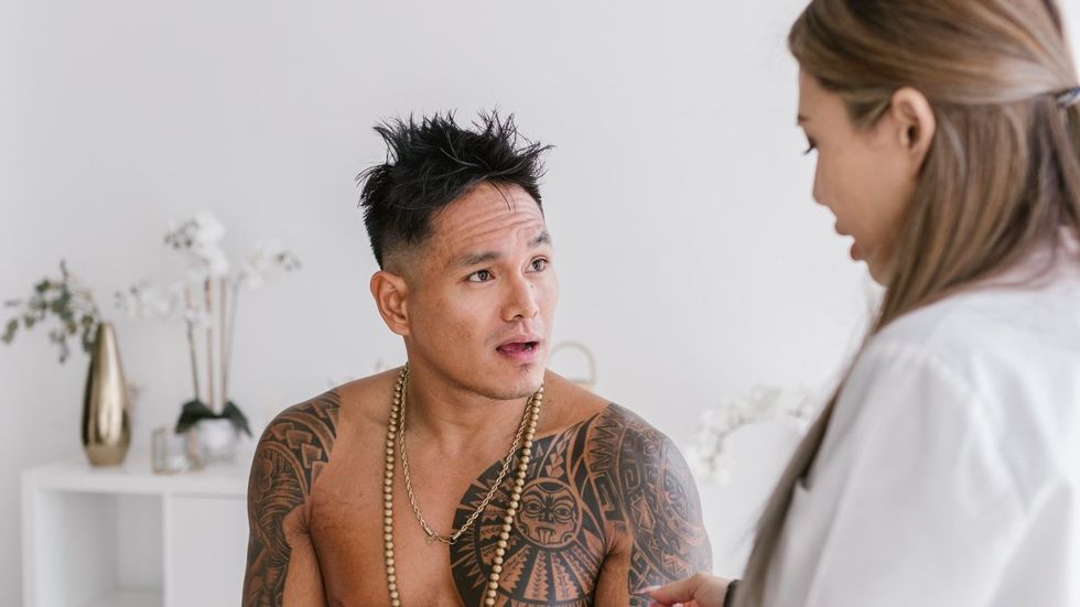 Man speaking to doctor