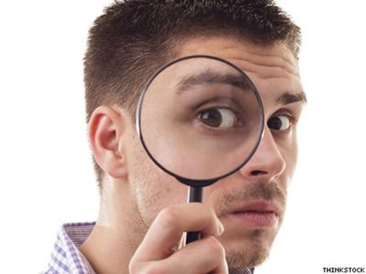Man-with-magnifying-glass-x400