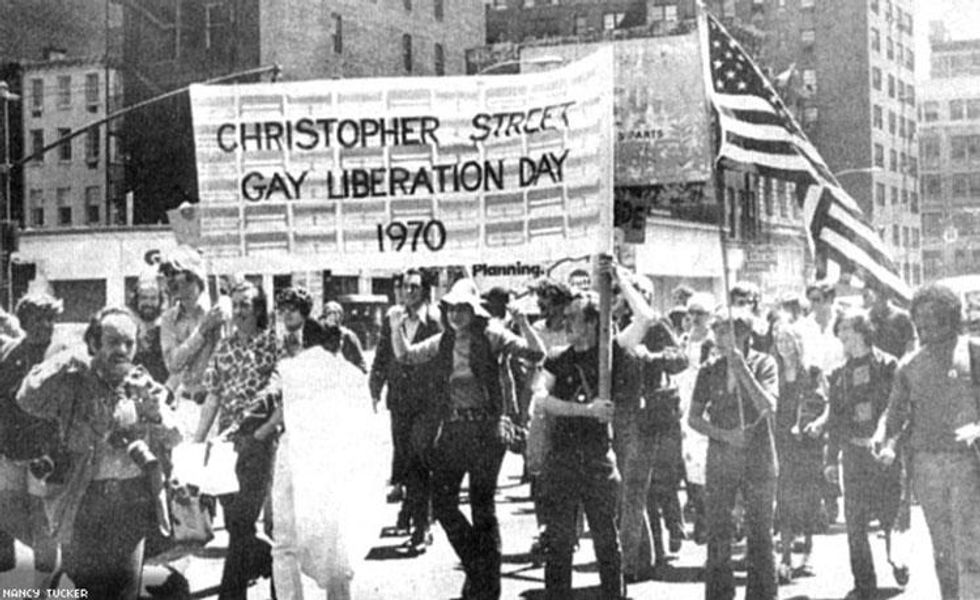 New York: Parading up Sixth Avenue to Central Park for the big Gay-In; thousands of participants marched and attended.