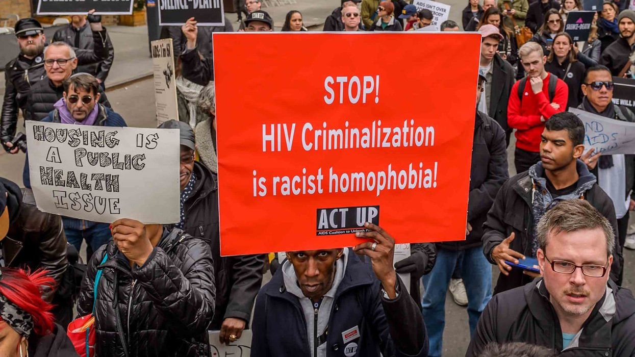 Protestors hold signs at an ACT UP demonstration