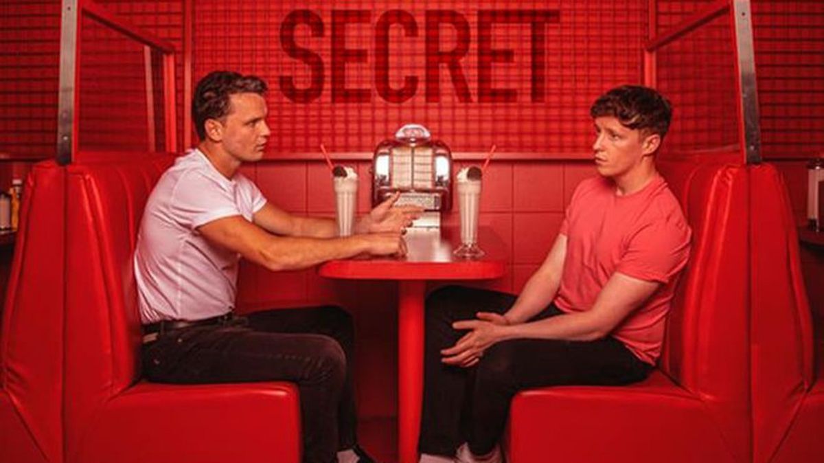two young men sitting at diner booth