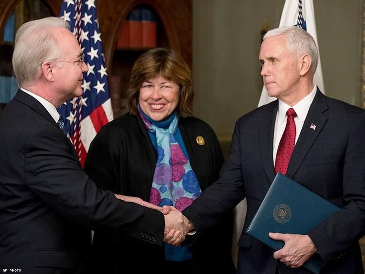 Vice President Mike Pence shakes hands with Health and Human Services Secretary Tom Price accompanied by his wife Betty Price after a swearing-in ceremony.